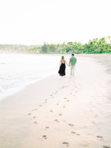 film photographer couple walking Kauai engagement photoshoot