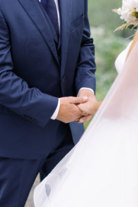 Alaska wedding ceremony holding hands