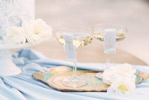 blue wedding champagne glasses with tags
