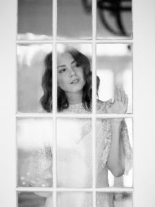 bridal portrait in chair french doors film photographer